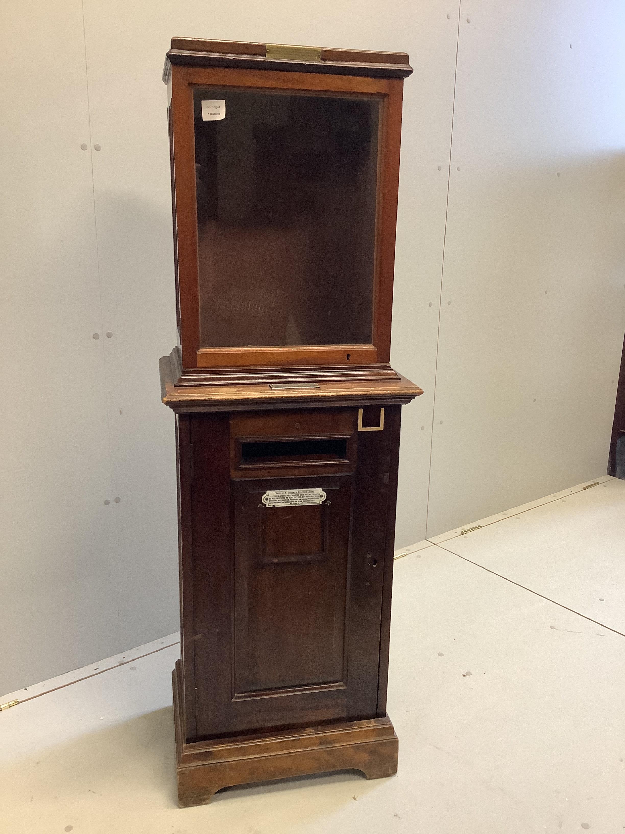 An early 20th century Hall Accessories Ltd., mahogany telephone/internal posting box, width 49cm, depth 35cm, height 148cm